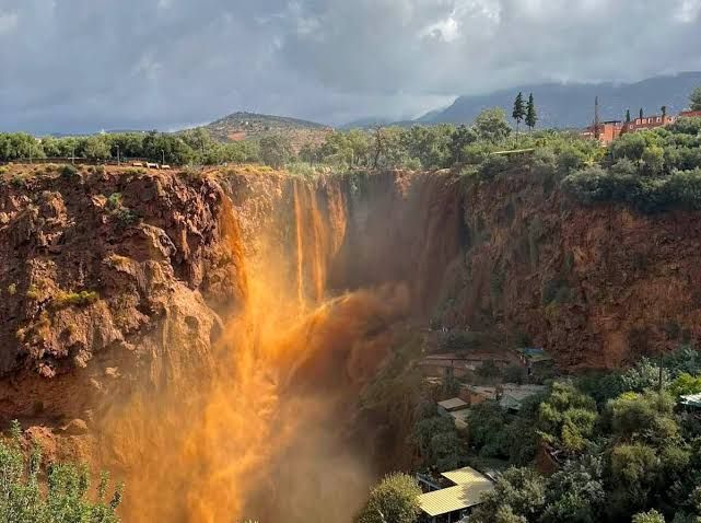 The Ouzoud Waterfalls in flood, the water coloured by red earth after heavy rain