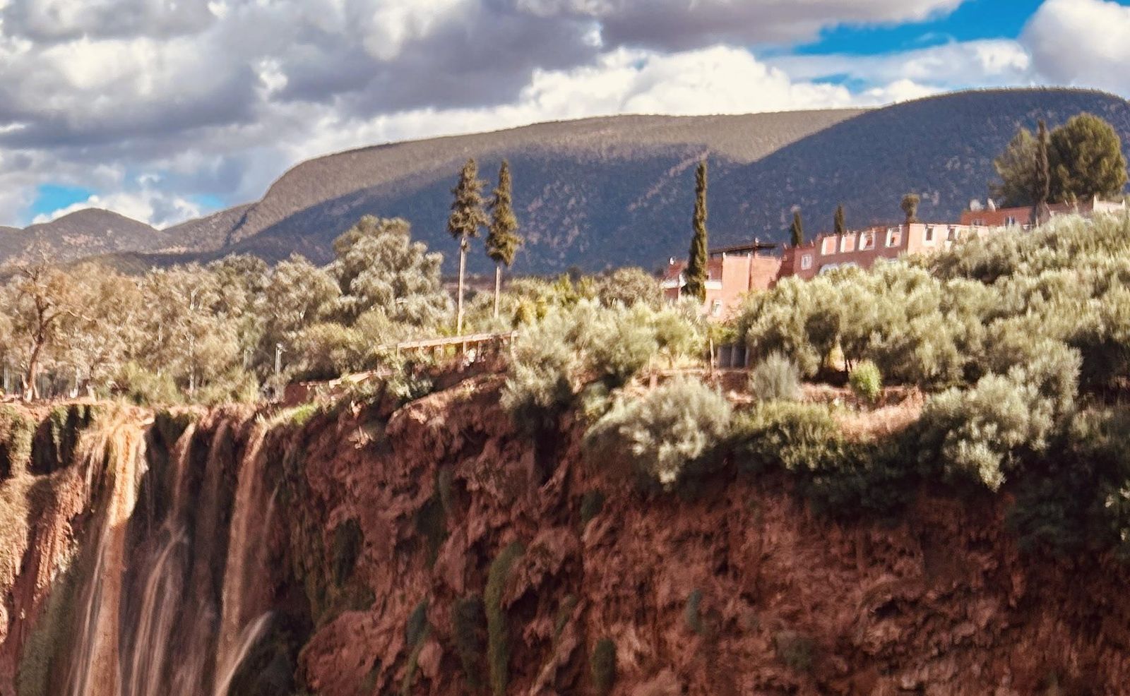 Guesthouses and houses of Ouzoud village on the edge of the cliffs above the falls